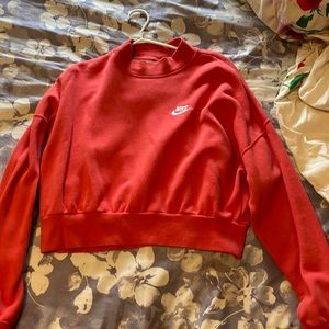 Candy red, Nike turtleneck sweater with fleece material inside.